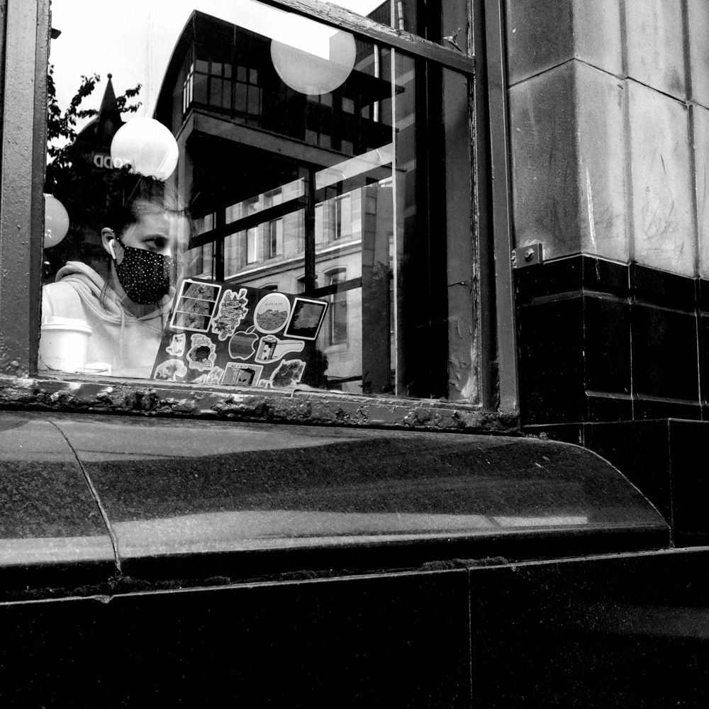 Coffee shop working with reflections